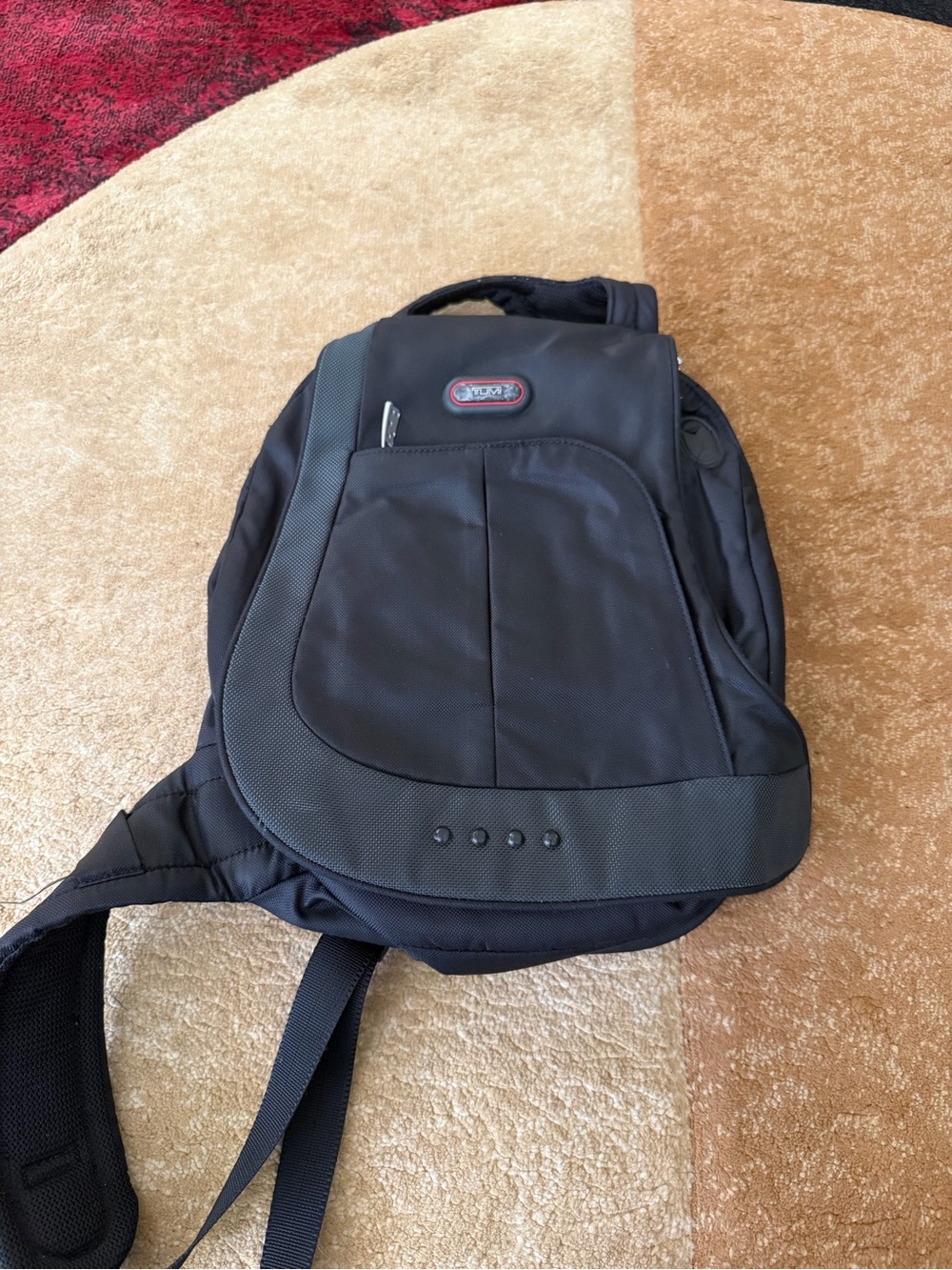TUMI black one-shoulder sling bag backpack